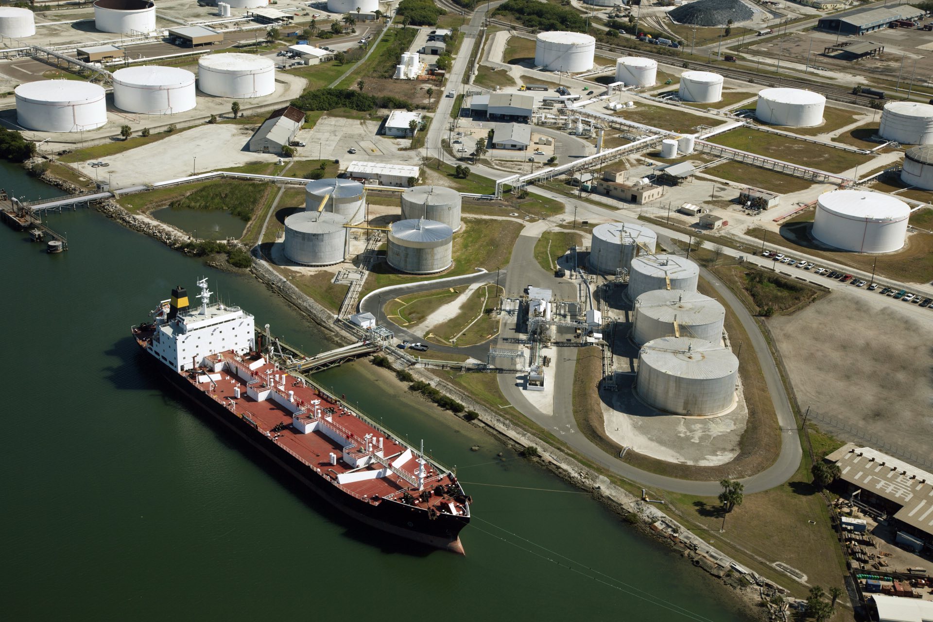 Aerial view of a strategic liquid-storage terminal and marine loading infrastructure